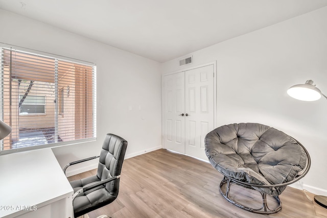 14801 N 25th Dr Unit 2, Phoenix, AZ 85023 - home office with wood finished floors, baseboards, and healthy amount of natural light