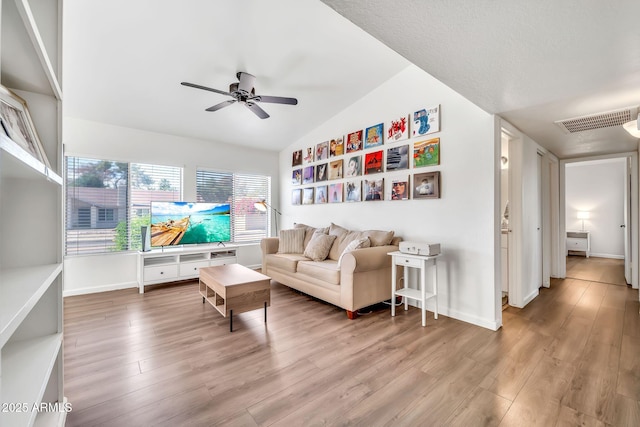 14801 N 25th Dr Unit 2, Phoenix, AZ 85023 - living area featuring vaulted ceiling, ceiling fan, wood finished floors, and baseboards
