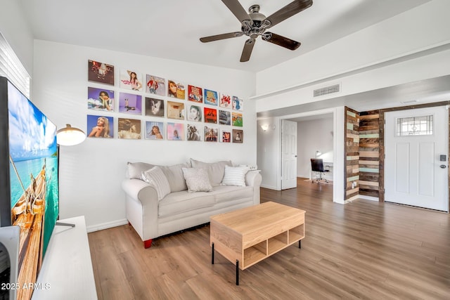 14801 N 25th Dr Unit 2, Phoenix, AZ 85023 - living room with wood finished floors, ceiling fan, and baseboards