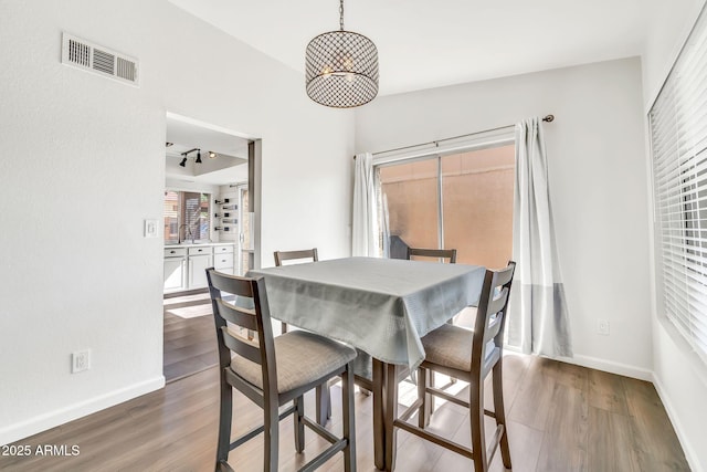 14801 N 25th Dr Unit 2, Phoenix, AZ 85023 - dining space with wood finished floors and baseboards