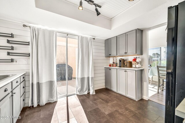 14801 N 25th Dr Unit 2, Phoenix, AZ 85023 - kitchen featuring gray cabinetry, a raised ceiling, light countertops, and freestanding refrigerator