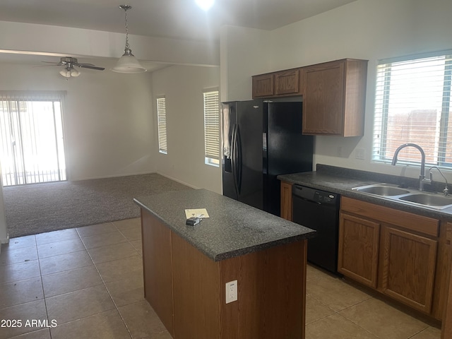 kitchen with sink, a center island, ceiling fan, a healthy amount of sunlight, and black appliances