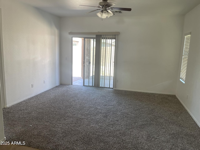 spare room with carpet floors and ceiling fan