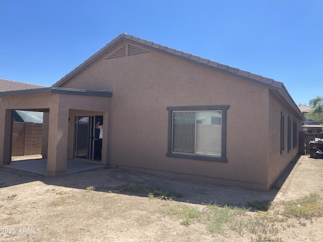 rear view of property with a patio