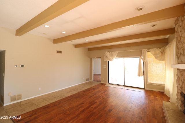 unfurnished room with beam ceiling, recessed lighting, visible vents, wood finished floors, and baseboards