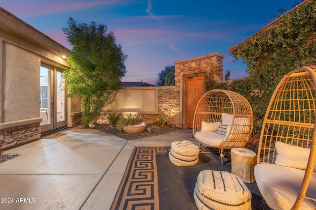 view of patio terrace at dusk