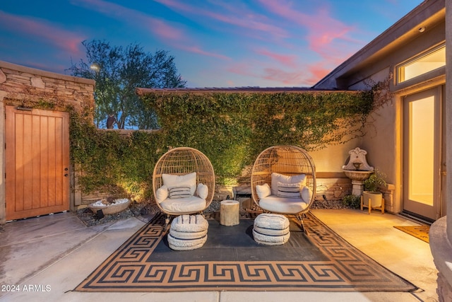 view of patio terrace at dusk