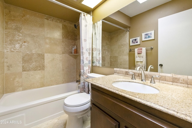 full bathroom featuring vanity, toilet, tile patterned flooring, and shower / bath combination with curtain