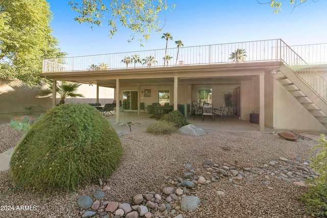 rear view of property with a patio area