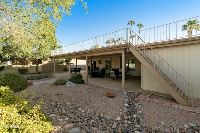 back of property with a patio area