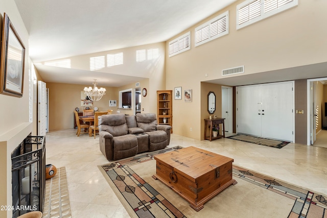 living room featuring a high ceiling and a notable chandelier