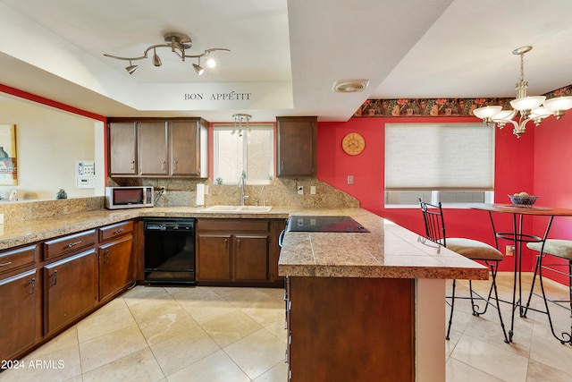 kitchen featuring dishwasher, sink, backsplash, kitchen peninsula, and pendant lighting