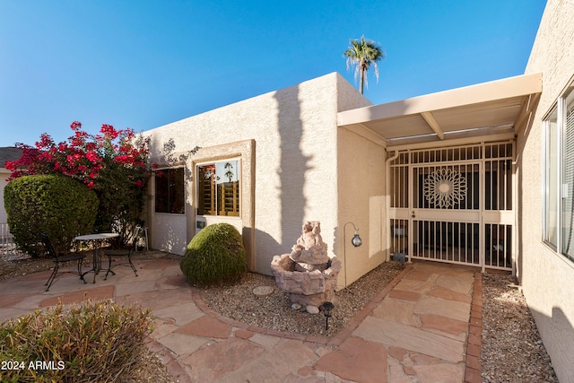 view of side of property with a patio area