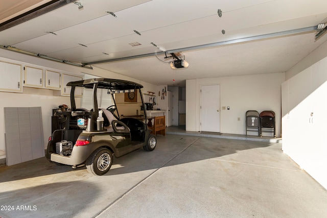 garage featuring a garage door opener