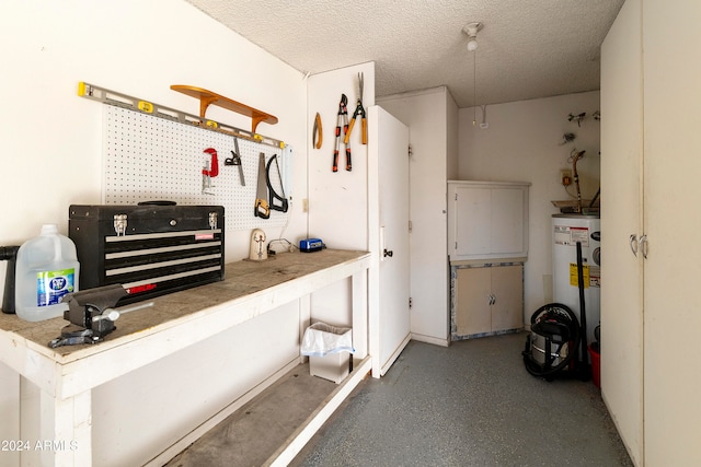 garage featuring water heater and a workshop area