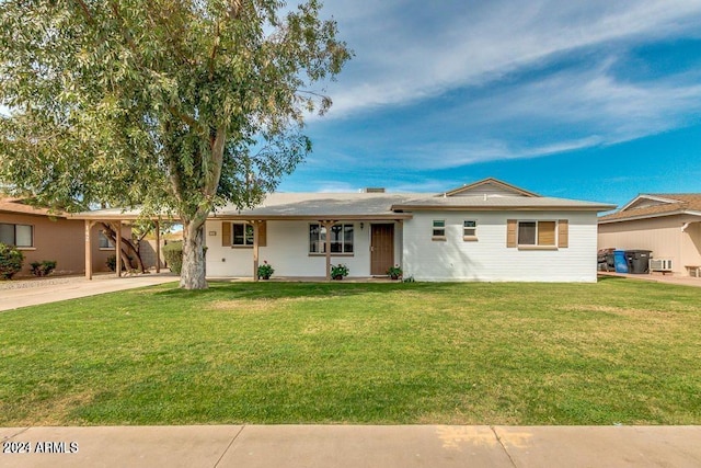 ranch-style house with a carport and a front yard