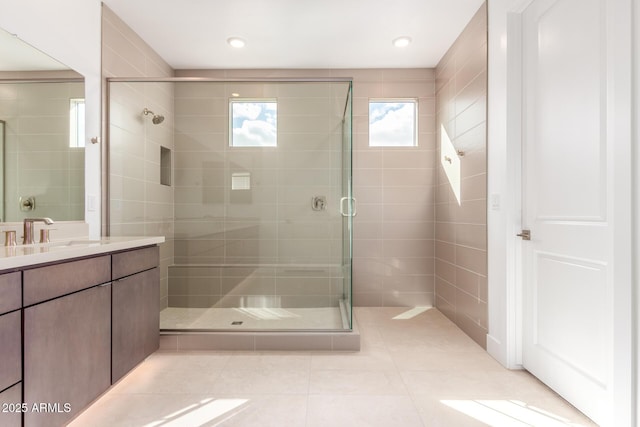 full bath featuring a stall shower, vanity, recessed lighting, and tile patterned floors