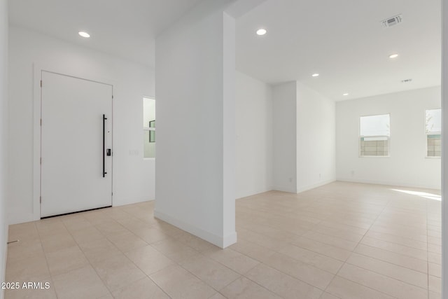 entryway featuring recessed lighting, visible vents, baseboards, and light tile patterned floors