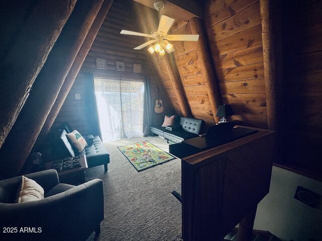 interior space with ceiling fan, wood ceiling, and vaulted ceiling