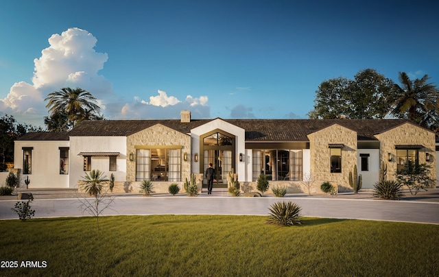5636 E Caballo Dr, Paradise Valley, AZ 85253 - view of front of property featuring french doors, a chimney, a front lawn, and stone siding