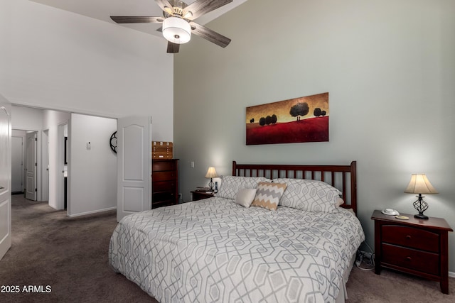 bedroom featuring baseboards, carpet, ceiling fan, and a high ceiling