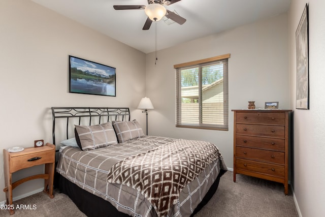 bedroom featuring a ceiling fan, baseboards, and carpet