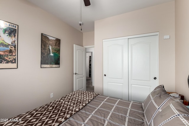 bedroom with a ceiling fan and a closet