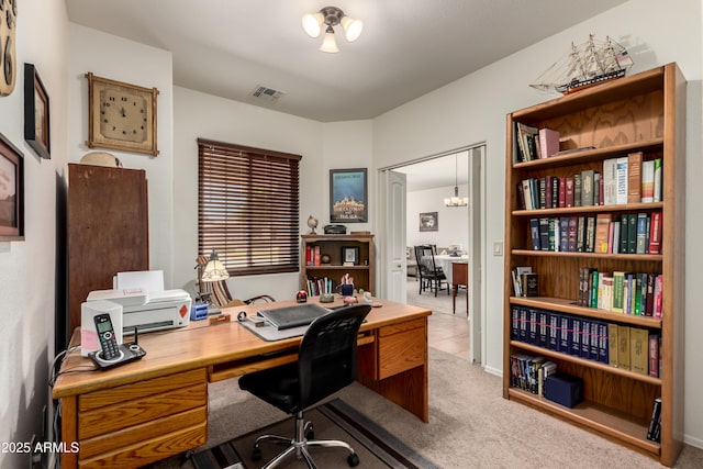 home office with visible vents and carpet