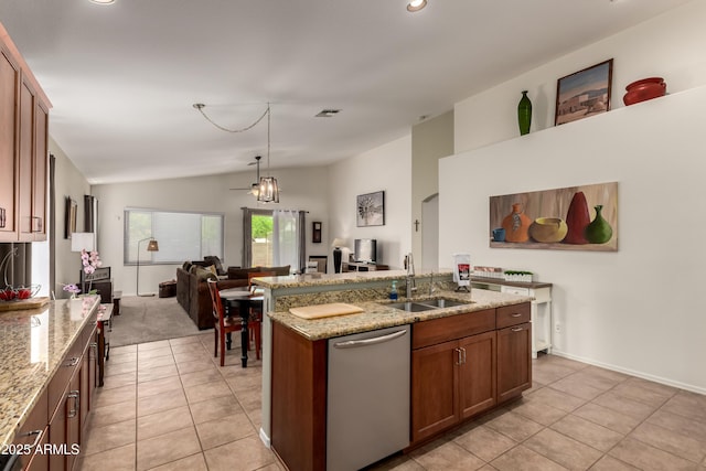 kitchen with light tile patterned flooring, open floor plan, a sink, and lofted ceiling
