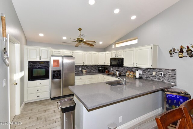 7916 E Naranja Ave, Mesa, AZ 85209 - kitchen with black appliances, a peninsula, tasteful backsplash, white cabinets, and vaulted ceiling