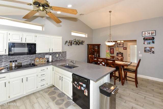 7916 E Naranja Ave, Mesa, AZ 85209 - kitchen with black appliances, lofted ceiling, a sink, tasteful backsplash, and a peninsula