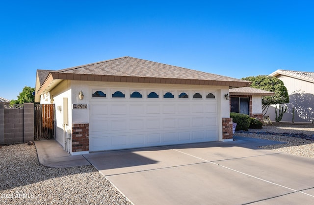 7916 E Naranja Ave, Mesa, AZ 85209 - ranch-style home featuring a shingled roof, a garage, brick siding, and driveway