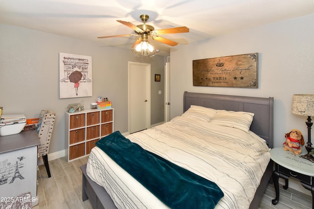 7916 E Naranja Ave, Mesa, AZ 85209 - bedroom featuring light wood-style floors, a ceiling fan, a desk, and baseboards