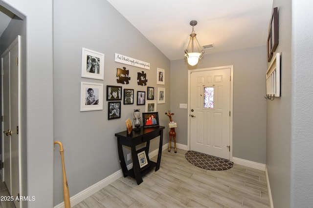 7916 E Naranja Ave, Mesa, AZ 85209 - foyer entrance featuring baseboards, light wood-type flooring, and vaulted ceiling
