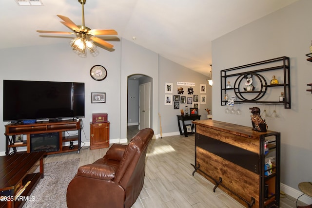 7916 E Naranja Ave, Mesa, AZ 85209 - living area featuring arched walkways, ceiling fan, light wood-style floors, baseboards, and high vaulted ceiling