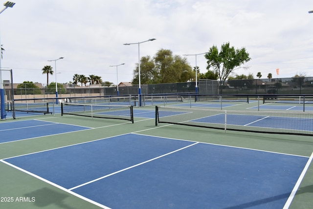 view of sport court featuring community basketball court and fence