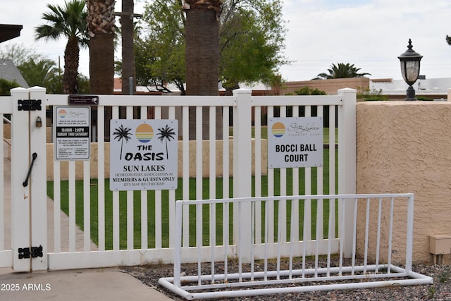 view of gate featuring fence