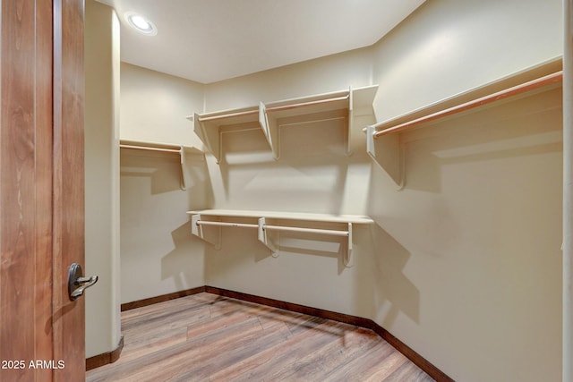walk in closet featuring light wood-style floors