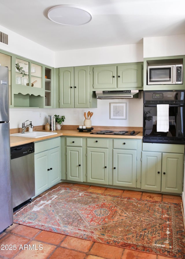 5246 N 20th St Unit B1, Phoenix, AZ 85016 - kitchen featuring black appliances, green cabinets, under cabinet range hood, and light countertops