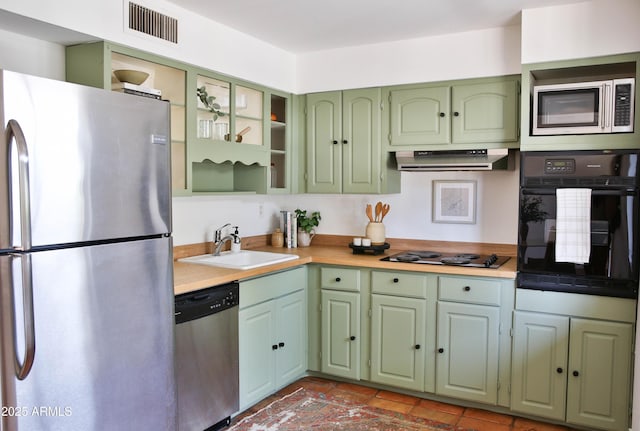 5246 N 20th St Unit B1, Phoenix, AZ 85016 - kitchen featuring black appliances, green cabinetry, light countertops, and under cabinet range hood