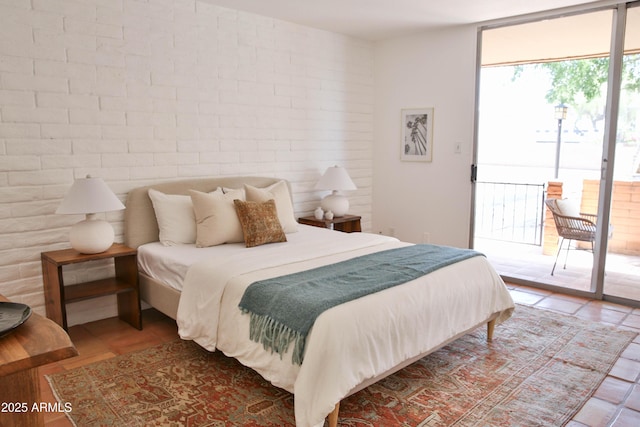 5246 N 20th St Unit B1, Phoenix, AZ 85016 - bedroom with access to outside and brick wall