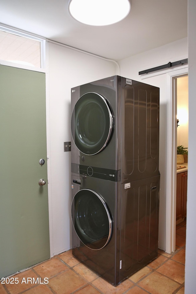 5246 N 20th St Unit B1, Phoenix, AZ 85016 - washroom featuring stacked washer and clothes dryer and stone tile flooring