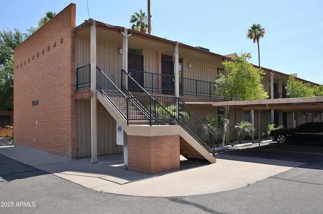 5246 N 20th St Unit B1, Phoenix, AZ 85016 - view of building exterior with stairs and covered parking