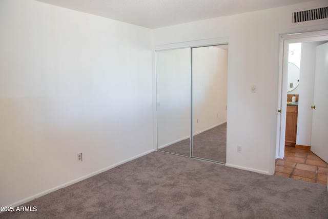 5246 N 20th St Unit B1, Phoenix, AZ 85016 - unfurnished bedroom featuring carpet and a closet