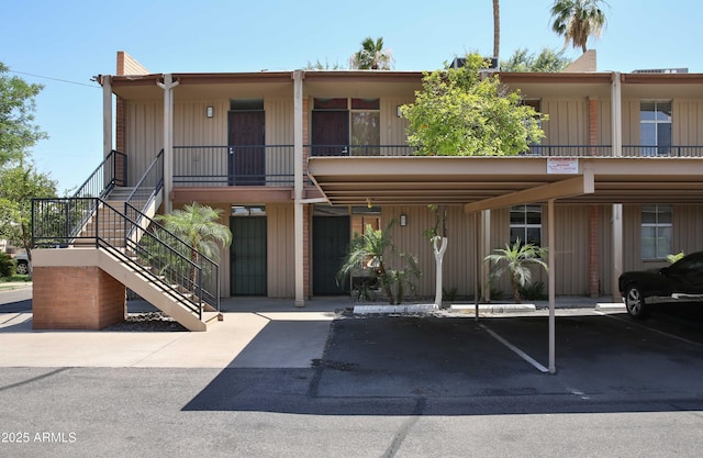 5246 N 20th St Unit B1, Phoenix, AZ 85016 - view of property featuring stairway and covered parking