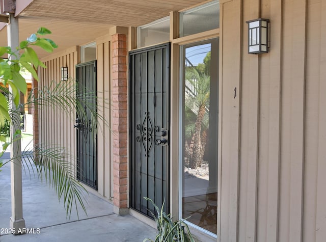 5246 N 20th St Unit B1, Phoenix, AZ 85016 - view of exterior entry featuring brick siding and board and batten siding