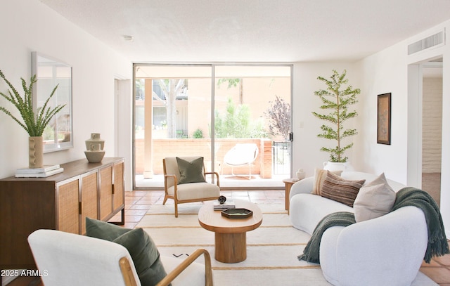 5246 N 20th St Unit B1, Phoenix, AZ 85016 - living area with floor to ceiling windows and light tile patterned flooring
