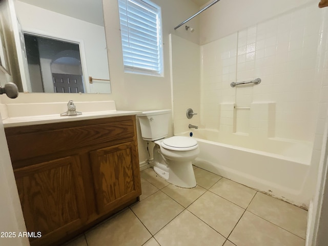 bathroom featuring vanity, tile patterned flooring, bathtub / shower combination, and toilet