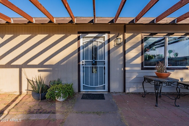 entrance to property with a patio area