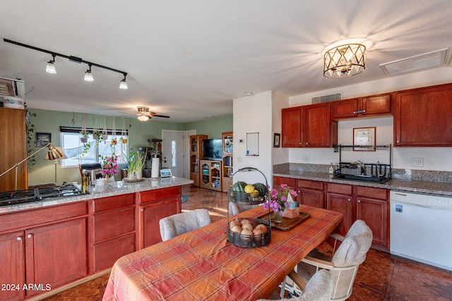 kitchen featuring dishwasher, stainless steel gas cooktop, sink, rail lighting, and ceiling fan